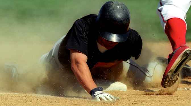 player sliding into base representing ways to get smart about college baseball recruiting
