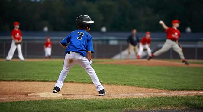 child baseball player representing specialization in a sport to get a scholarship