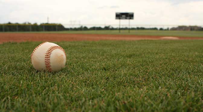 ball on field representing why some don't play college baseball