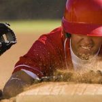 player sliding into base representing How to Get Recruited to Play College Baseball