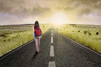 student walking on road representing if college matters