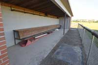 empty baseball dugout representing division 2 baseball schools